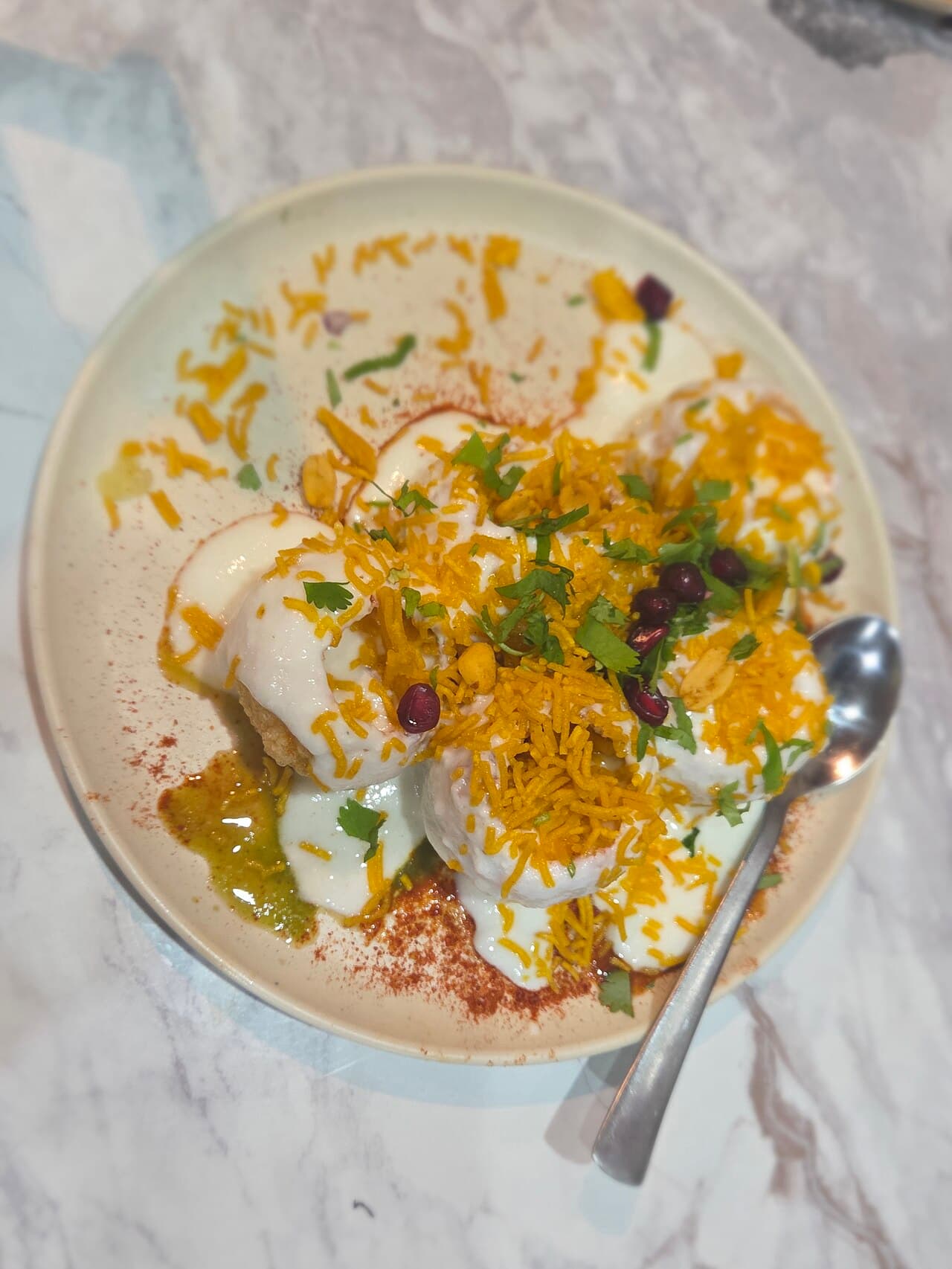 Chilled yogurt dahi puri with tamarind drizzle