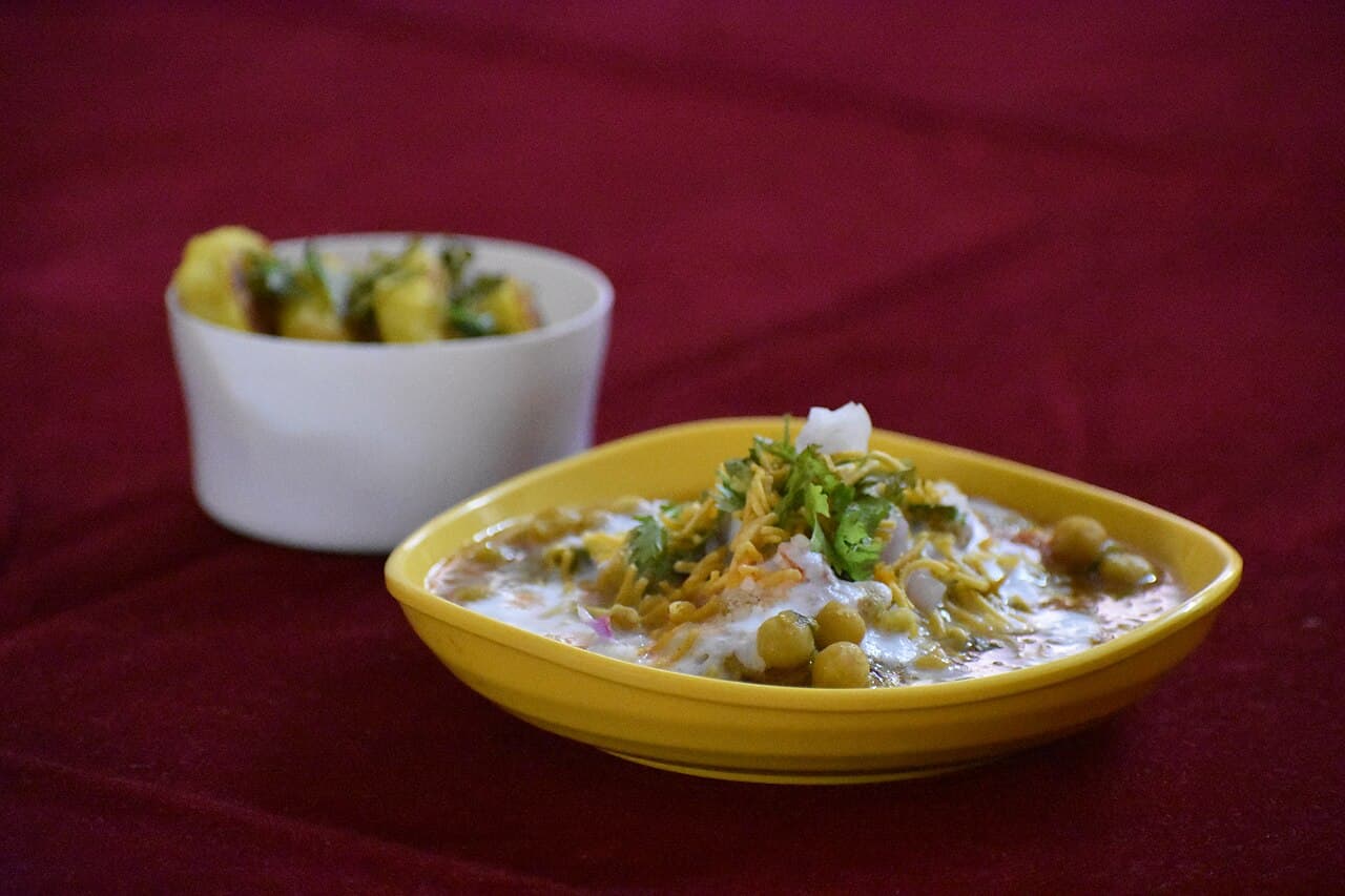 Guests sharing a platter of puris
